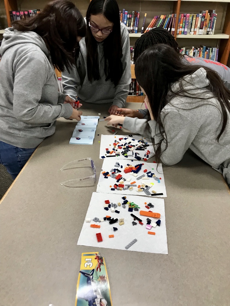 students working with legos at table