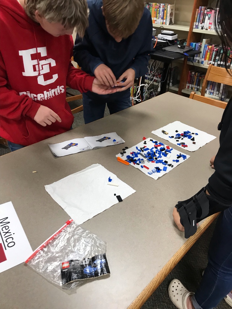 students working with legos at table