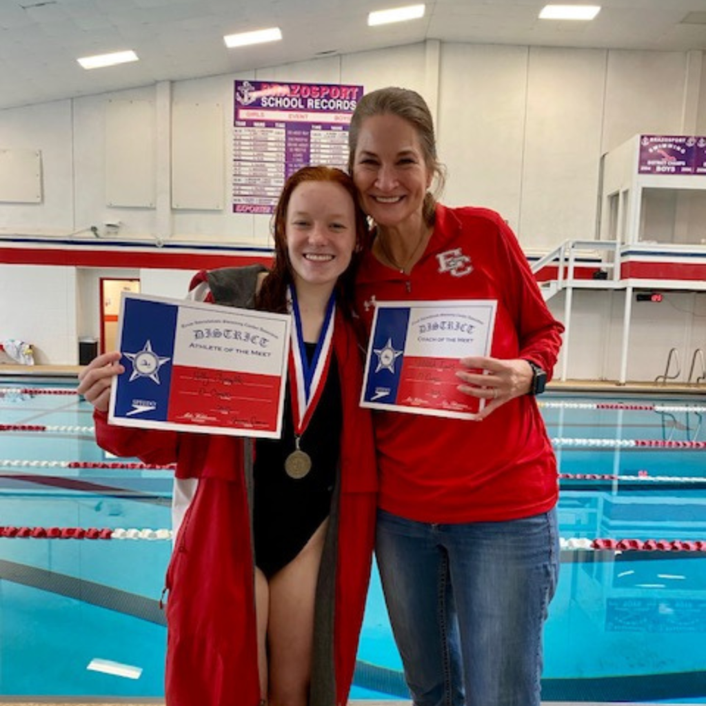 district champ diver and dive coach of the meet with their certificates