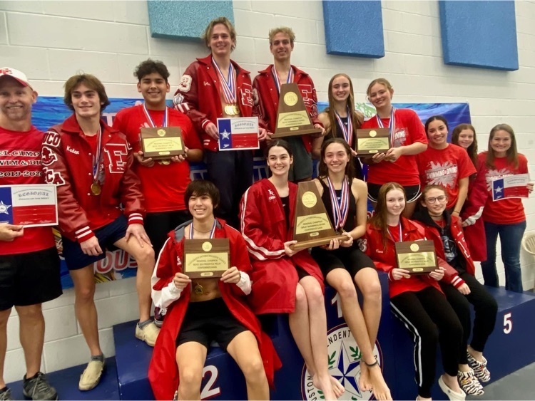 swim and dive team posing with medals and plaques 