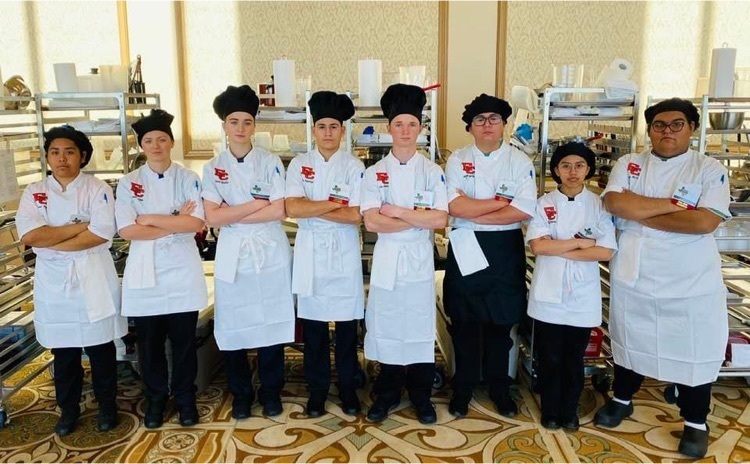 students in their chef uniforms 